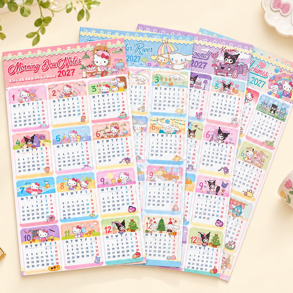Four pastel Hello Kitty monthly calendar sheets for 2027 are arranged in a fan shape on a light beige surface, surrounded by small decorative props including green leaves, gold paperclips, and washi tape.