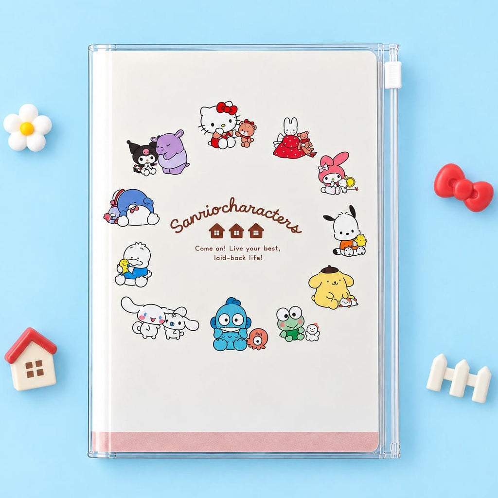 A 2027 Sanrio notebook case holding a white a circle of Sanrio characters printed around the center. The notebook is photographed on a light blue background with small decorative props around it.