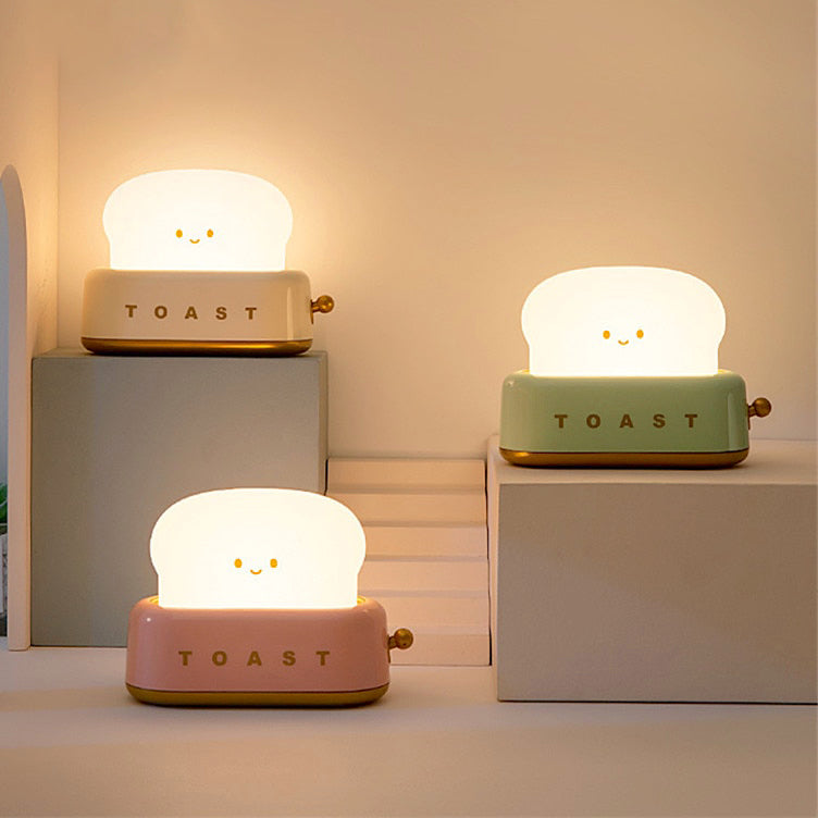 https://kawaiipenshop.com/cdn/shop/products/Mini-Toaster-Desk-Light-Kawaii-Bread-Lamp-Night-Light-Cute-1_1024x1024.jpg?v=1670038998