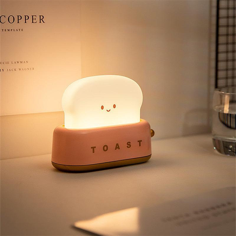 https://kawaiipenshop.com/cdn/shop/products/Mini-Toaster-Desk-Light-Kawaii-Bread-Lamp-Night-Light-Cute-5_1024x1024.jpg?v=1671546506